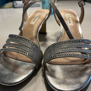 Sparkly prom shoes worn once!  Silver with lots of sparkly beading. Two in. heel